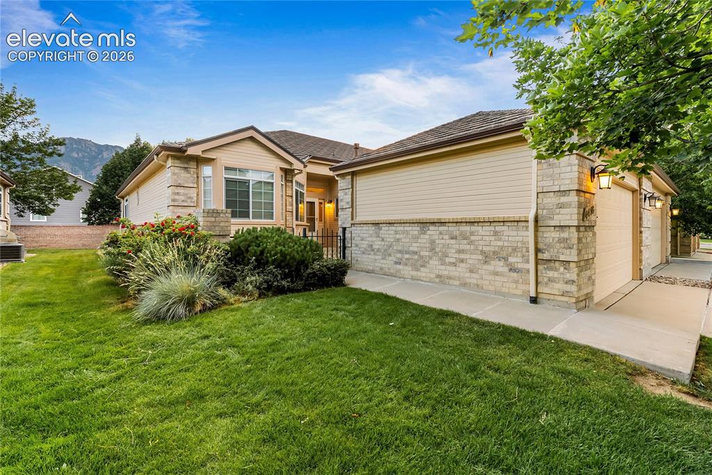 Image 1 of 41: Ranch-style exterior featuring a combination of light-colored brick and hor