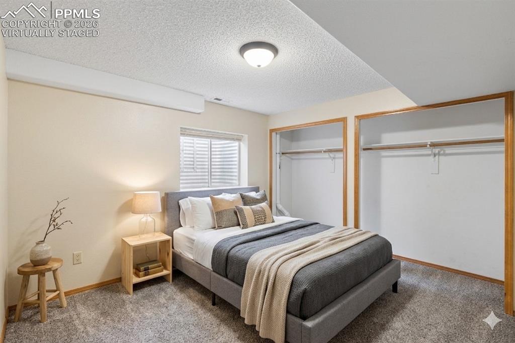 Image 12 of 32: "Virtually Staged" Upper primary bedroom suite, attached bathroom, walk-in
