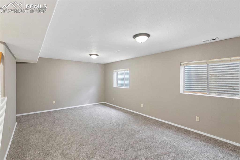 Image 28 of 32: finished basement