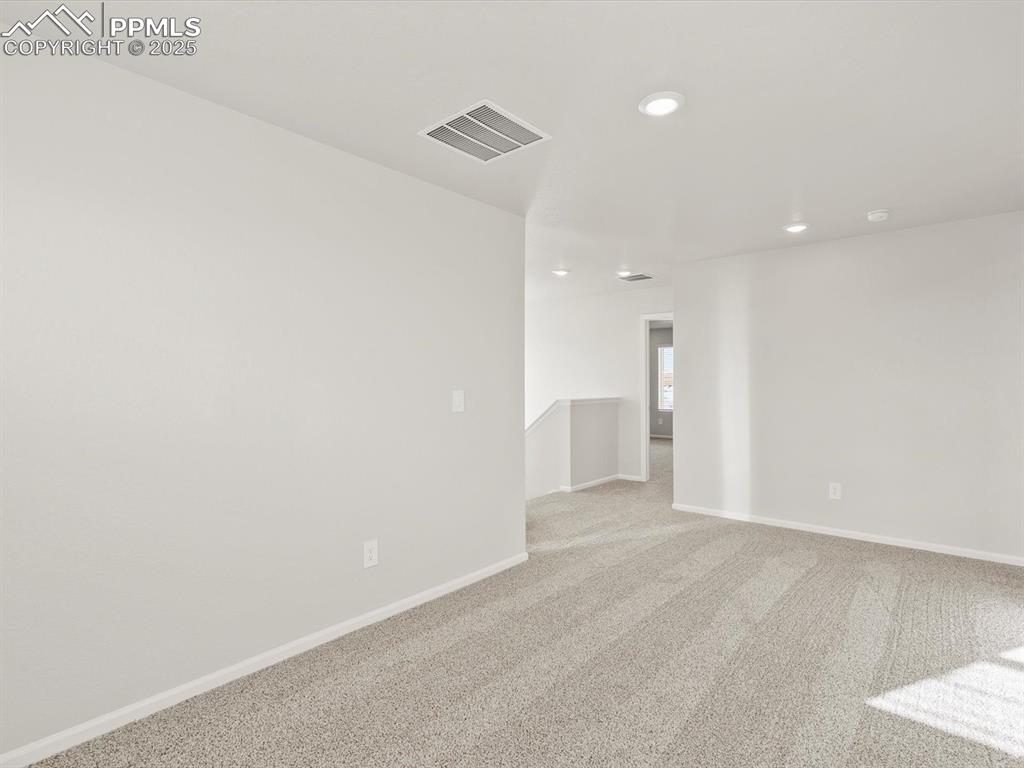 Image 14 of 26: Unfurnished room featuring light carpet and recessed lighting
