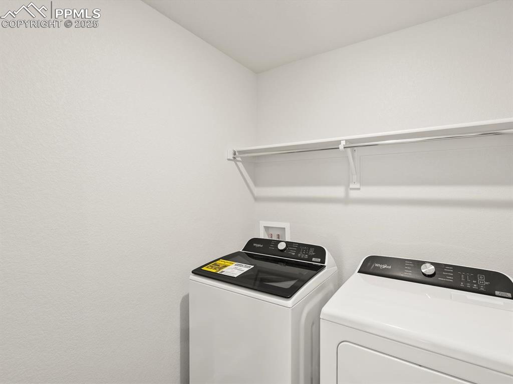Image 16 of 26: Laundry room with washing machine and dryer