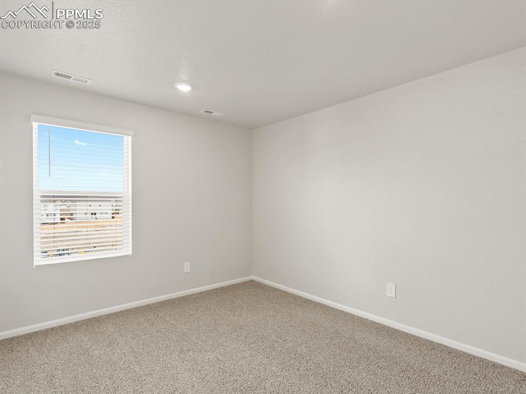 Image 19 of 26: Carpeted spare room featuring baseboards and recessed lighting