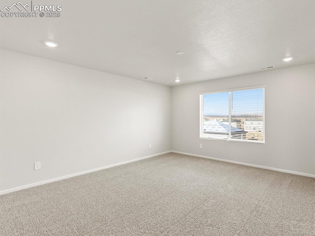 Image 20 of 26: Spare room with carpet and recessed lighting