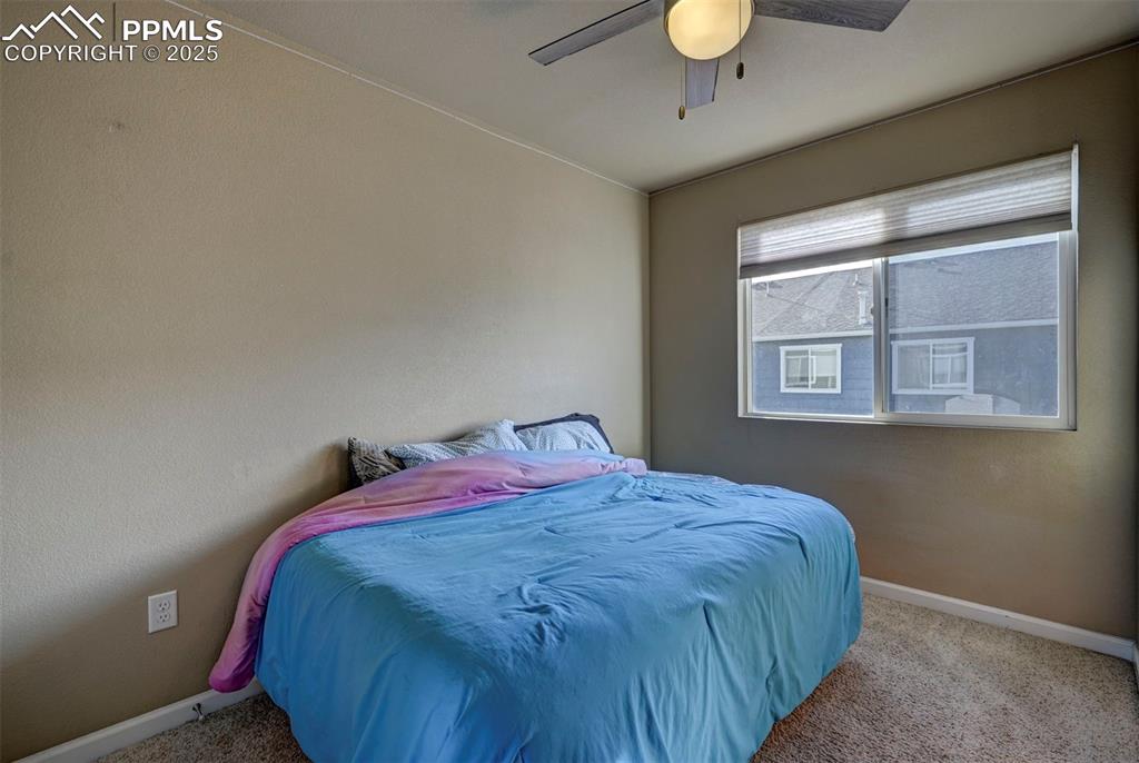Image 18 of 29: Bedroom featuring carpet floors and a ceiling fan