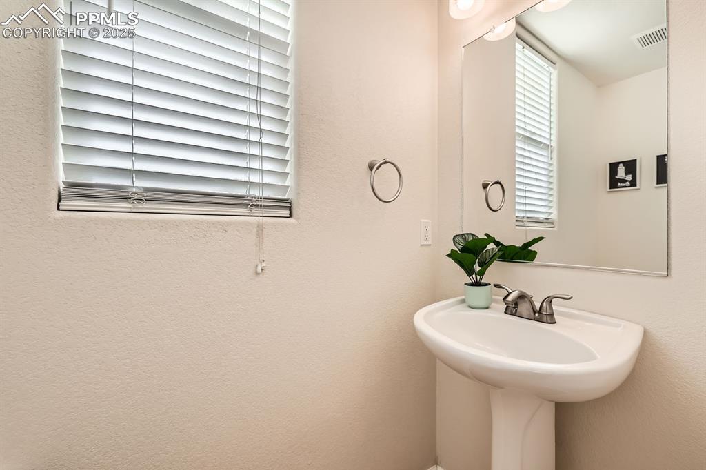 Image 14 of 39: Bathroom featuring a textured wall