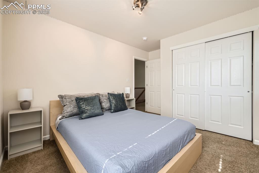 Image 23 of 39: Bedroom featuring a closet and baseboards