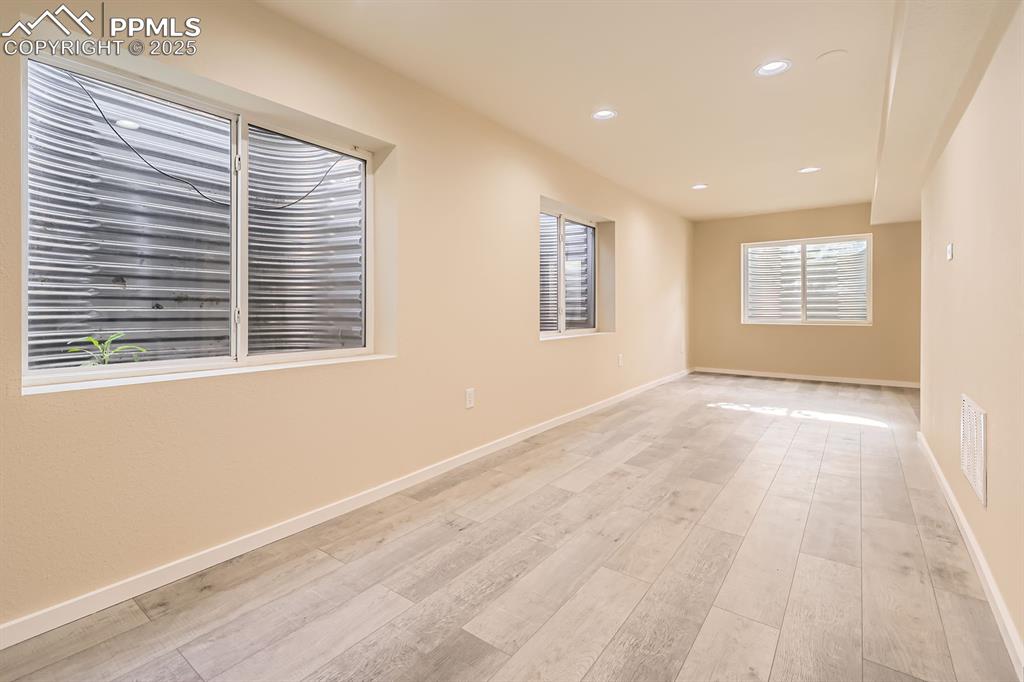 Image 28 of 39: Spare room featuring recessed lighting and light wood-style flooring