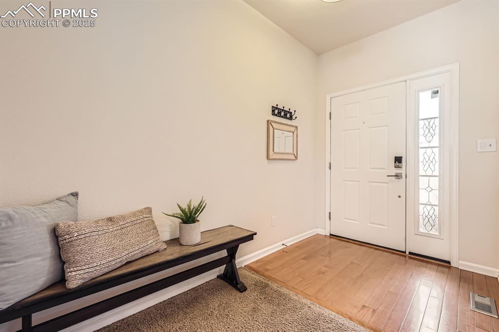Image 5 of 39: Foyer entrance with light wood-type flooring and baseboards