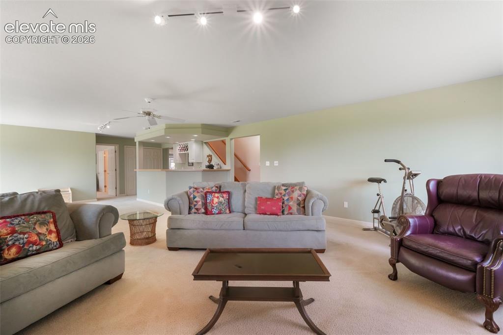 Image 30 of 50: Bedroom featuring neutral wall paint, carpet flooring, and a flat ceiling