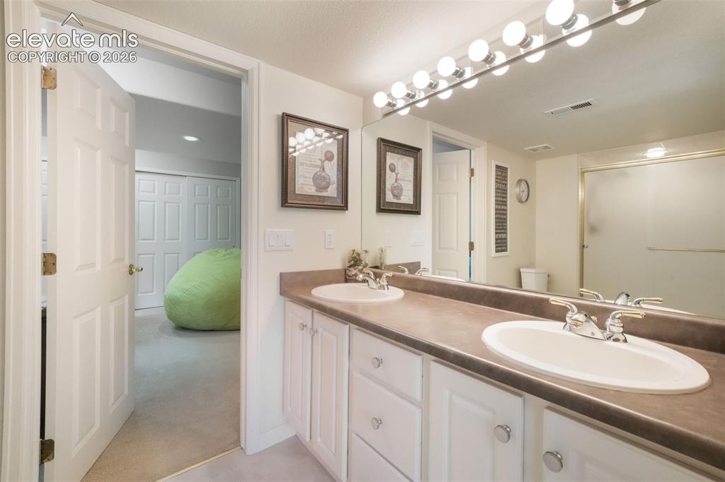 Image 38 of 50: Carpeted room with a paneled white door, recessed lighting, and a flush-mou