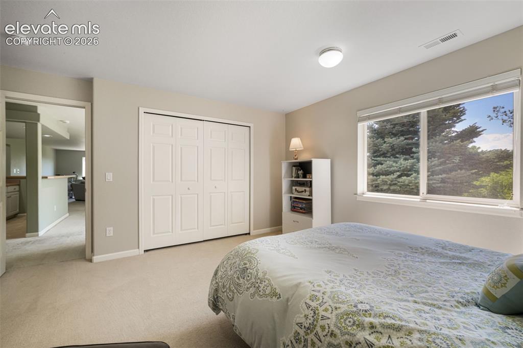Image 40 of 50: Interior room featuring light neutral wall paint, recessed lighting, white