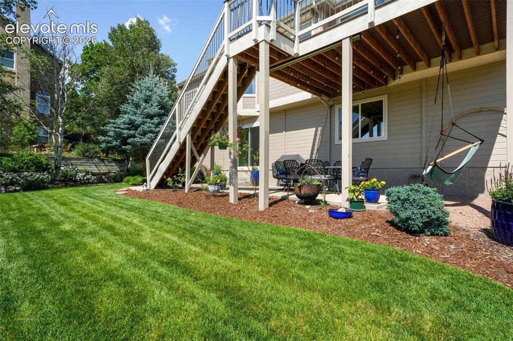 Image 44 of 50: Spacious outdoor deck featuring wood-finish flooring and a light-toned wood