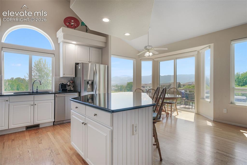 Image 8 of 50: Vaulted ceilings with recessed lighting and ceiling fans
