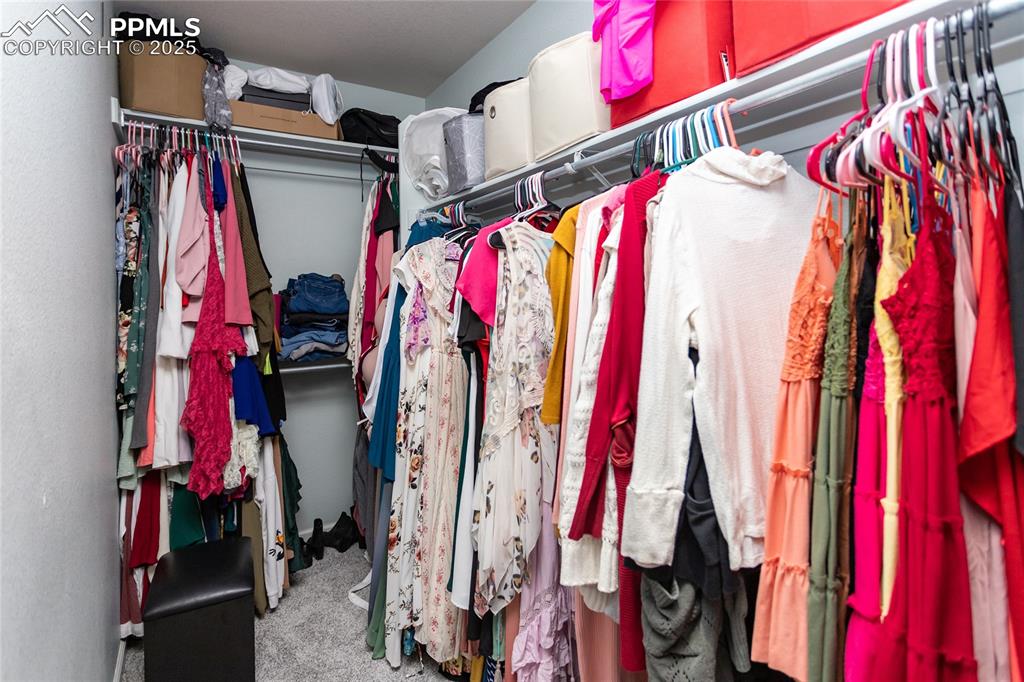 Image 24 of 35: walk in closet-primary bedroom 