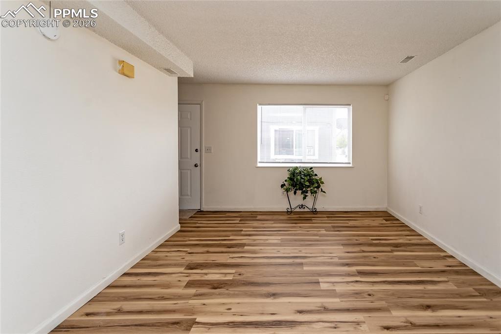 Image 8 of 12: Living room with new flooring