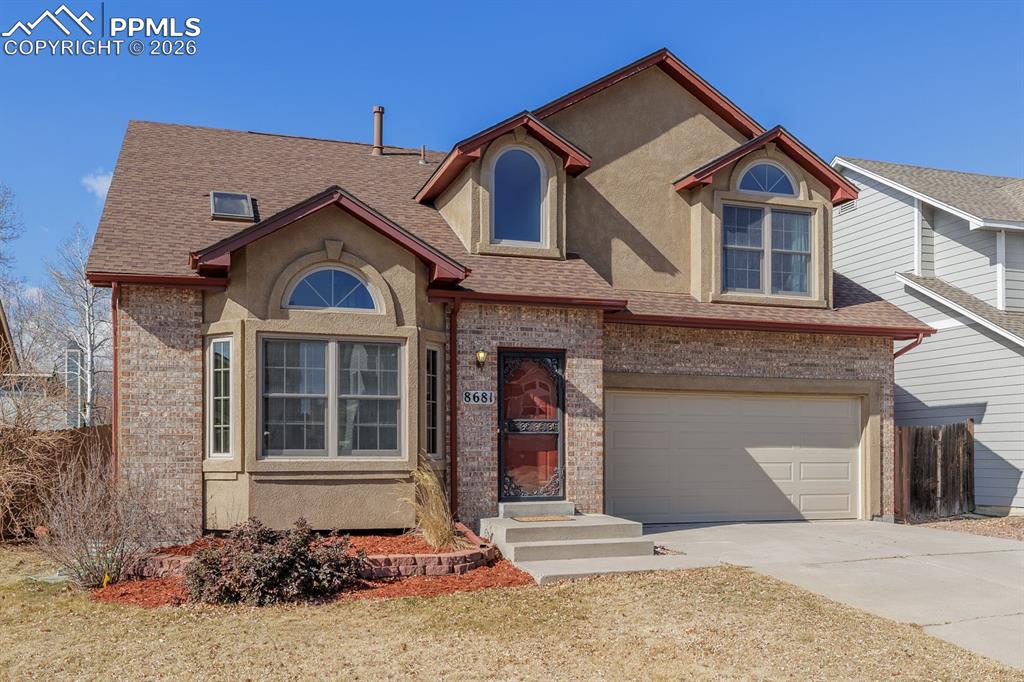 Image 2 of 40: Bay window in the living room adds a wonderful sitting/reading nook