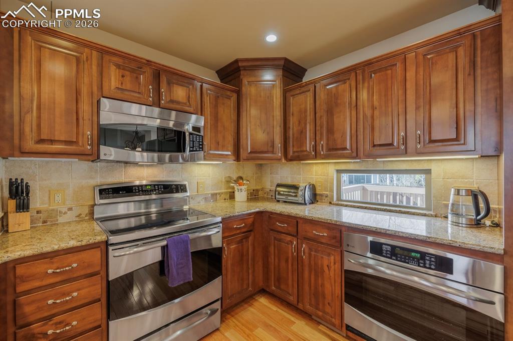 Image 9 of 40: Custom cabinetry with soft close drawers and pull-outs for heavy pots