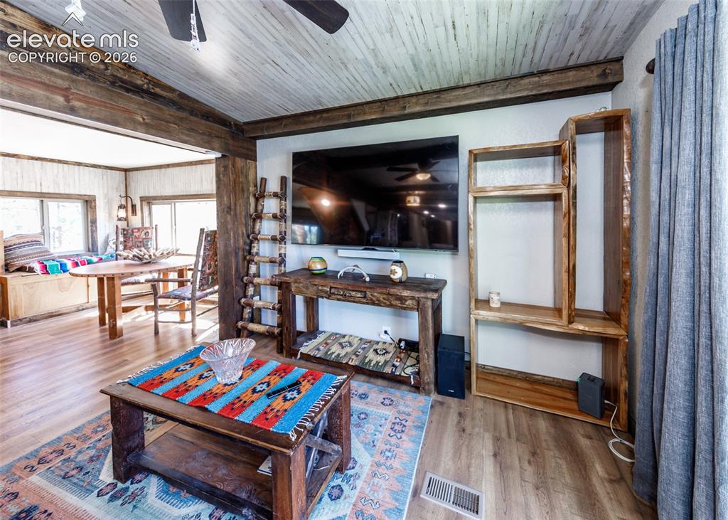 Image 25 of 50: Family room and walkout to the back deck