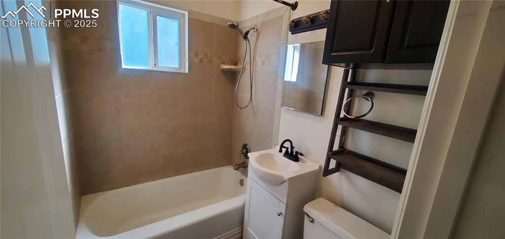 Image 11 of 22: Bathroom with plenty of natural light, toilet, shower / tub combination, an