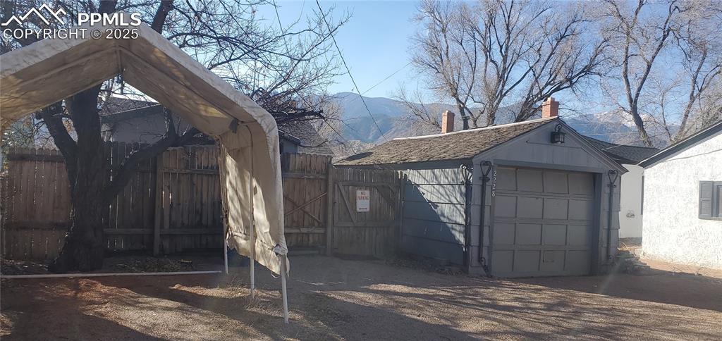 Image 13 of 22: Garage featuring a mountain view