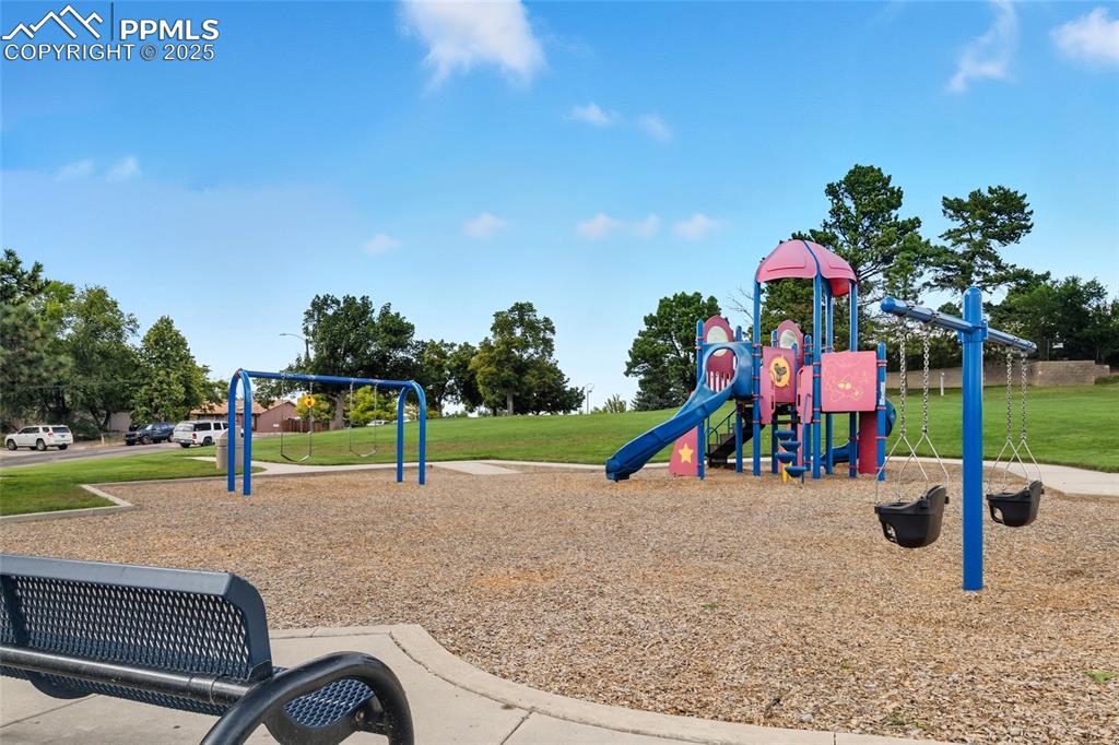 Image 38 of 39: Community play area with a lawn