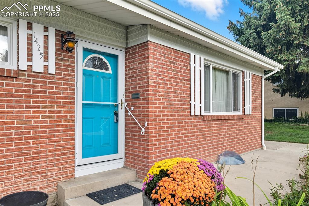 Image 4 of 39: Entrance to property with brick siding