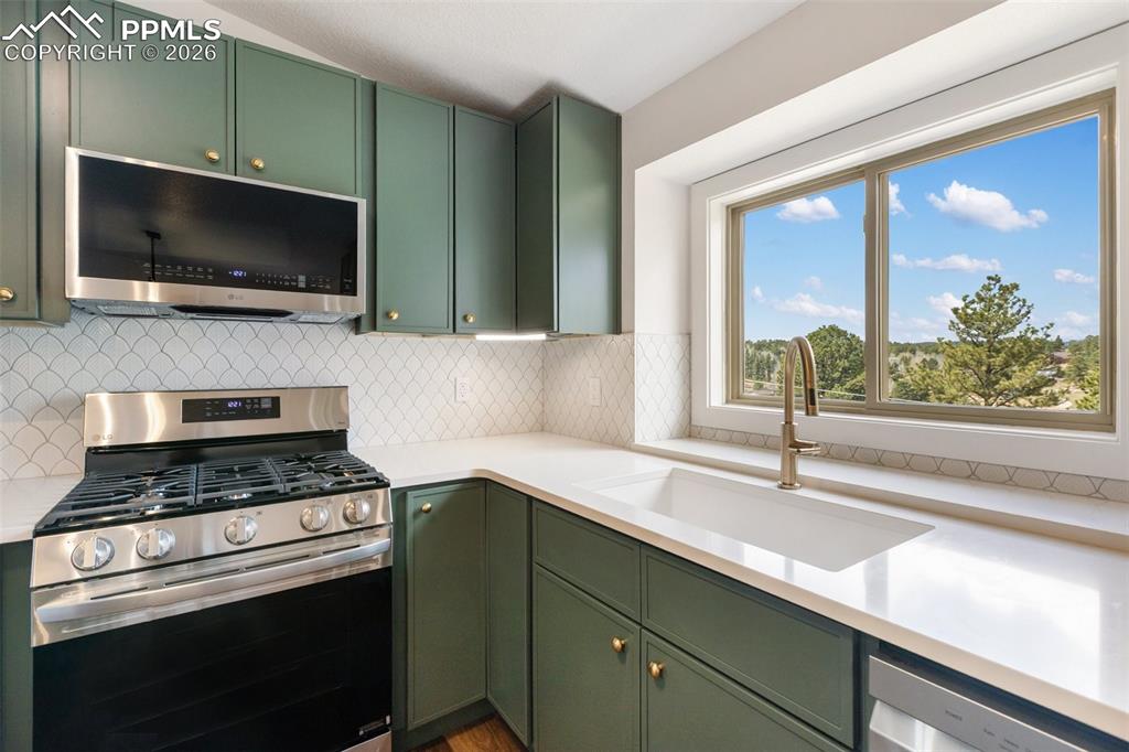 Image 16 of 44: Living Room and Dining Room with Kitchen