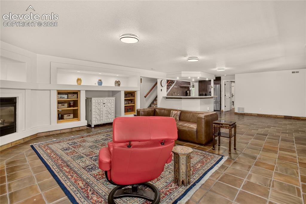 Image 35 of 46: Basement family room.
