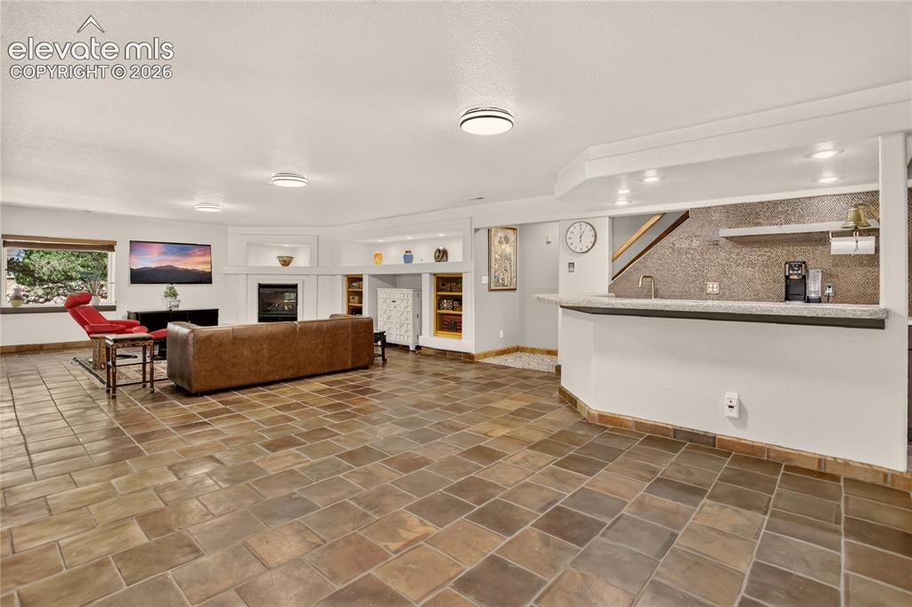 Image 36 of 46: Basement family room.