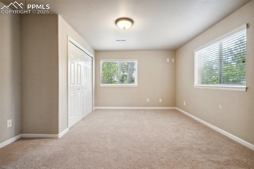 Image 46 of 49: Basement Bedroom