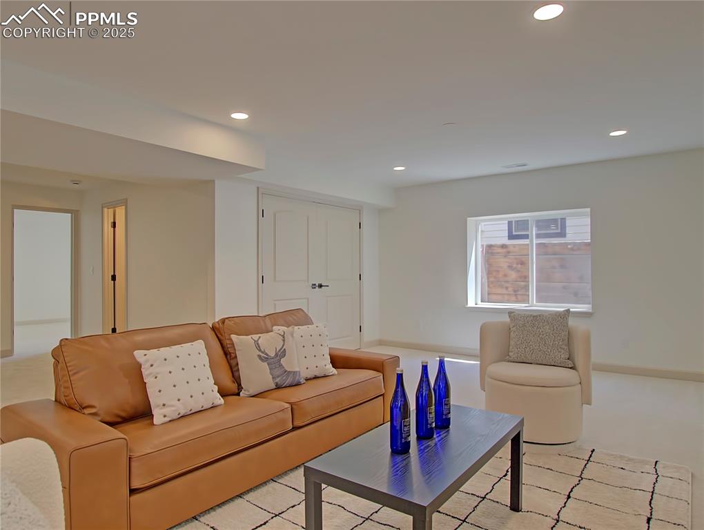 Image 41 of 50: Basement Living room featuring recessed lighting