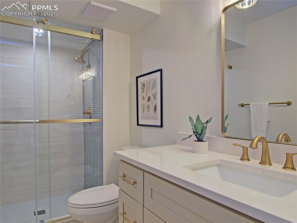 Image 44 of 50: Full bath featuring vanity and a stall shower