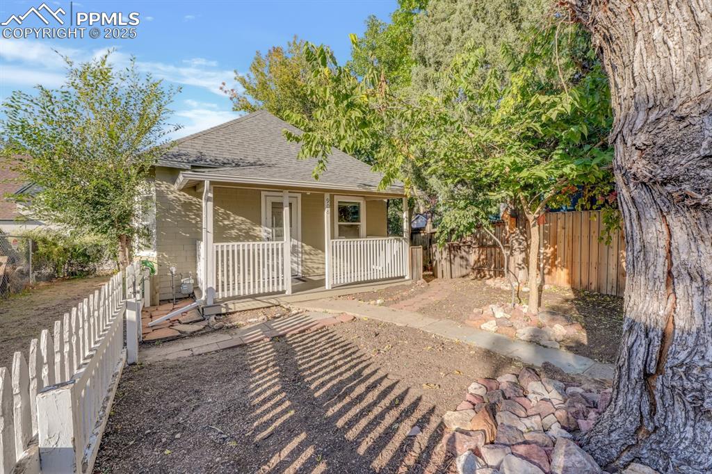Image 2 of 28: Back of property with roof with shingles and a fenced backyard