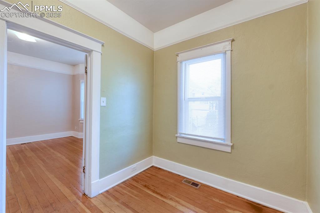 Image 22 of 28: Spare room with light wood finished floors
