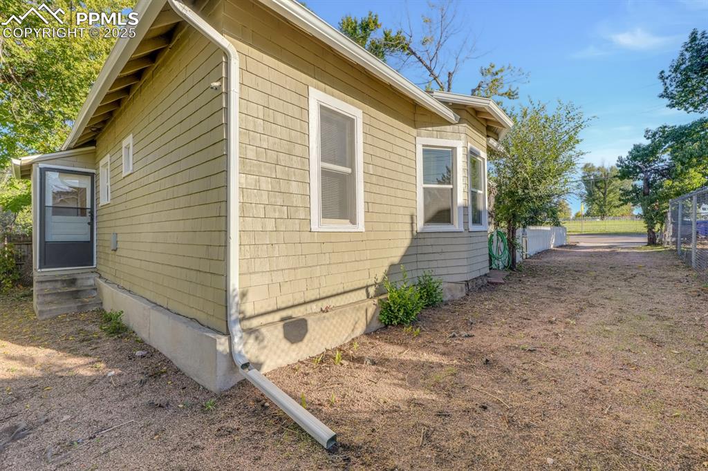 Image 25 of 28: View of property exterior with entry steps