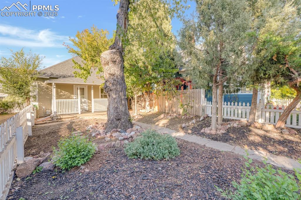 Image 4 of 28: View of yard featuring a porch