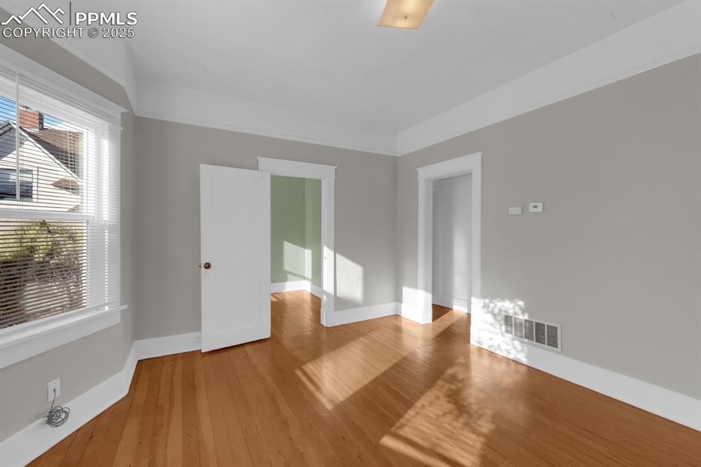 Image 6 of 28: Unfurnished room featuring baseboards and light wood finished floors