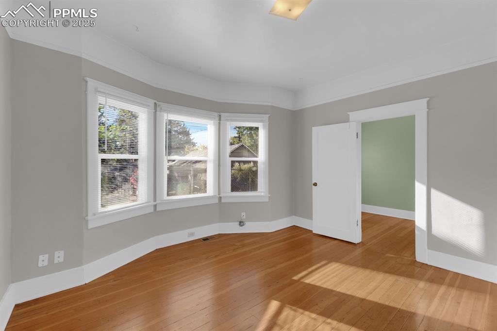 Image 7 of 28: Unfurnished room featuring light wood-type flooring and baseboards