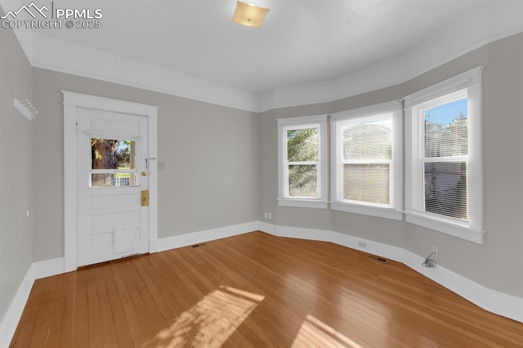 Image 8 of 28: Foyer entrance with plenty of natural light and light wood finished floors