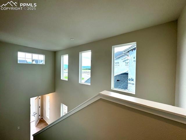 Image 14 of 14: Landing of second floor looking down to front door