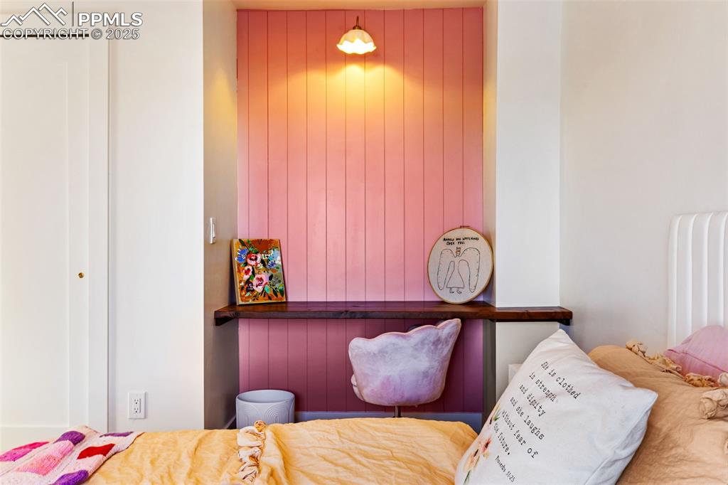 Image 19 of 49: Bedroom with wooden walls