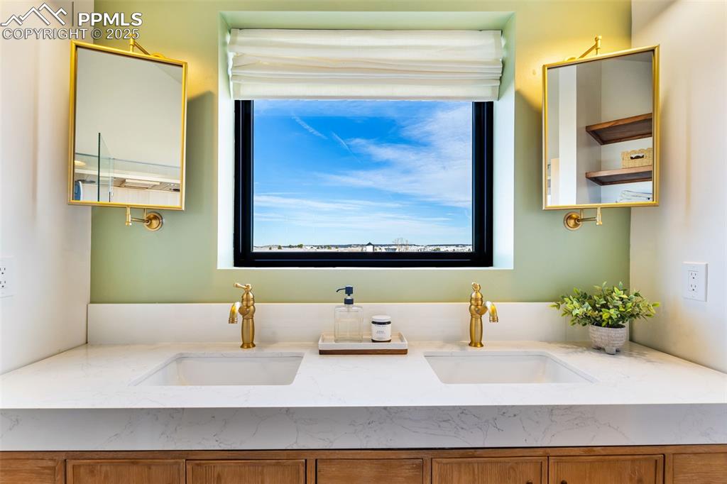 Image 24 of 49: Full bathroom featuring double vanity