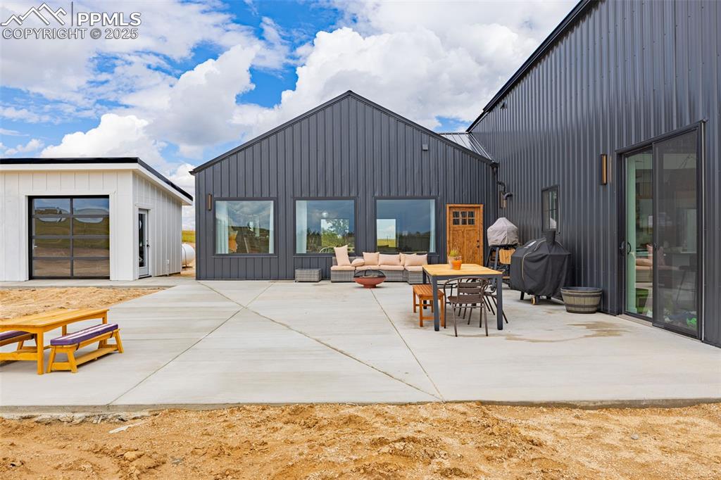 Image 49 of 49: View of patio / terrace with an outdoor hangout area and a grill