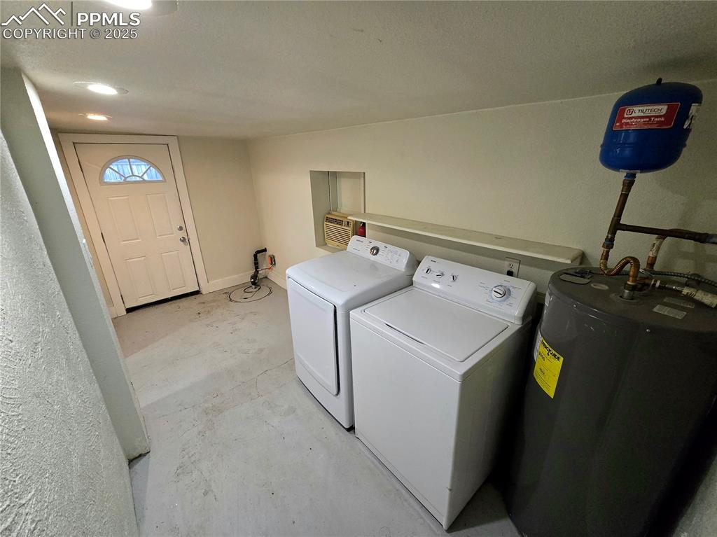 Image 15 of 22: Oversized laundry room opens to full bathroom. Washer and Dryer included.