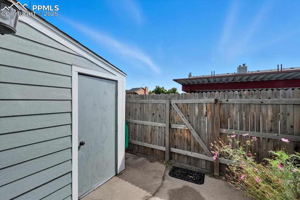 Image 14 of 34: View of patio / terrace featuring a storage unit