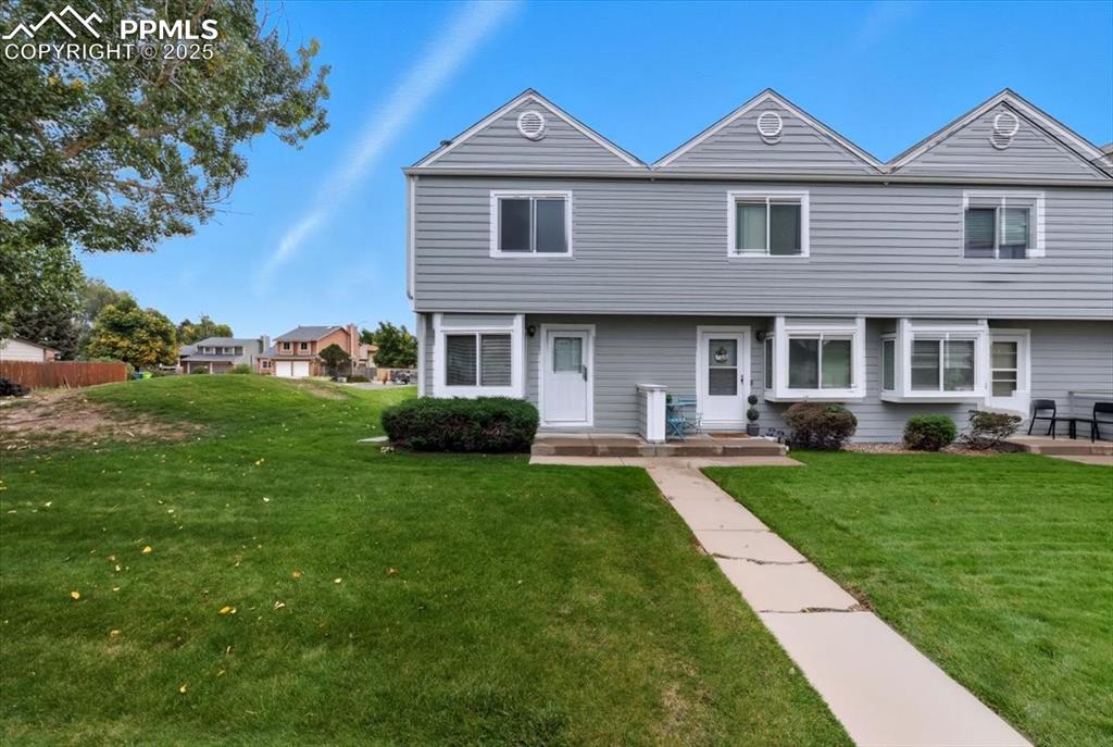 Image 26 of 34: Colonial house featuring a front yard