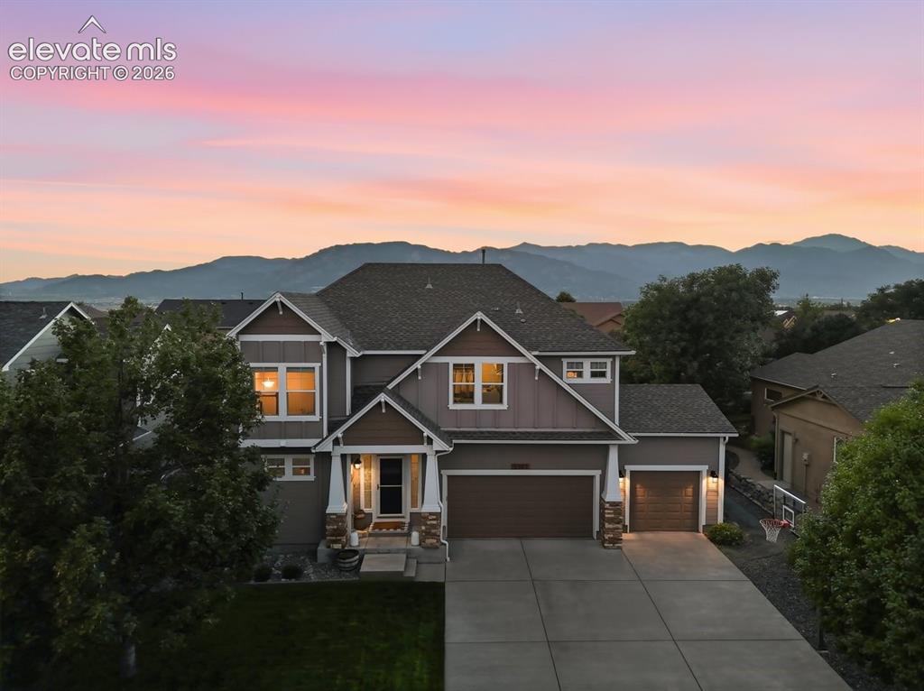 Image 1 of 50: stately home with amazing curb appeal and mountain views from the primary b