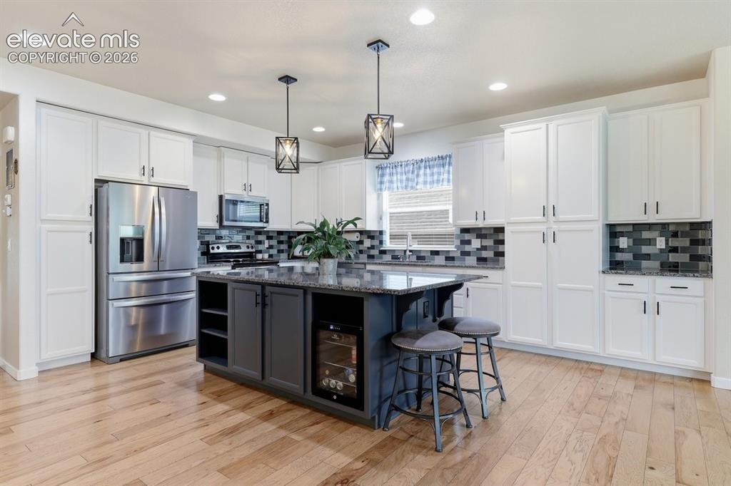 Image 10 of 50: granite countertops, stainless steel appliances, and lots of cabinet space 