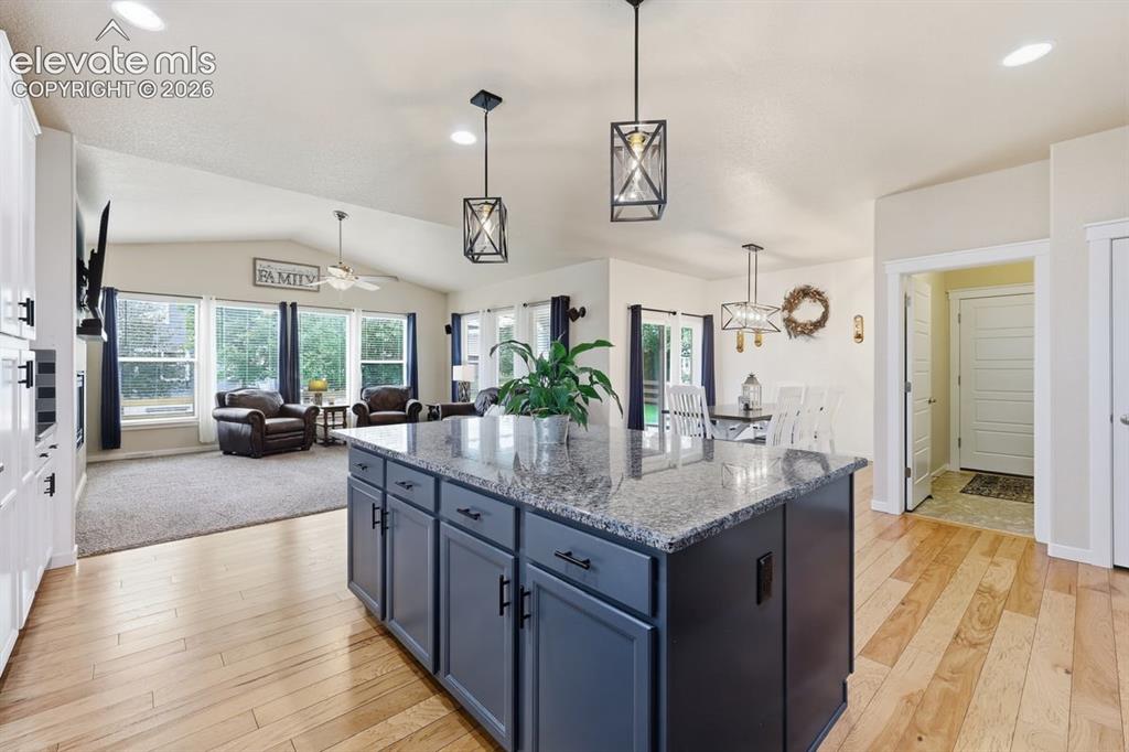 Image 11 of 50: kitchen flows effortlessly into the dining and living areas