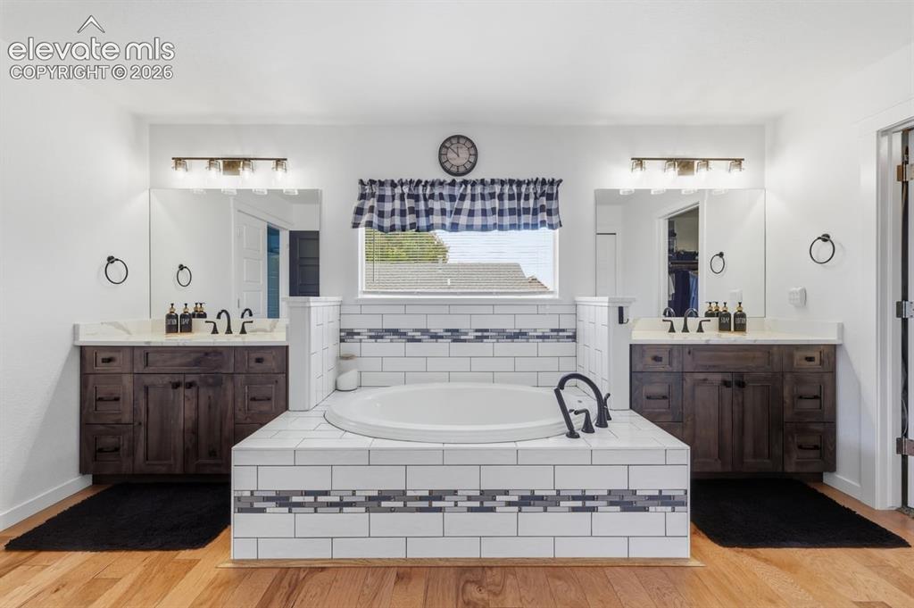 Image 19 of 50: a large soaking tub is the centerpiece of this bathroom